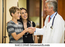 Patient shaking hands with dentist