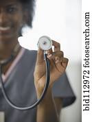 Black nurse holding up stethoscope