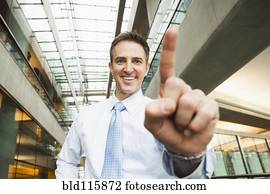Caucasian businessman holding up finger