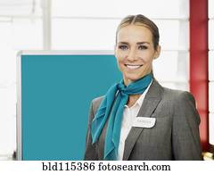 Caucasian hostess smiling