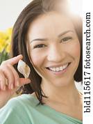 Caucasian woman holding seashell