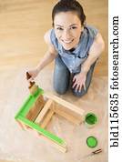 Caucasian woman painting stool