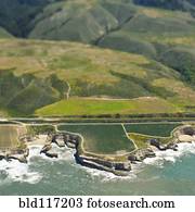Aerial View of a Coastal Road and Outcrop