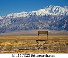 Chair in Mountainous, Desert Landscape