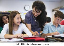 Teacher helping students in class