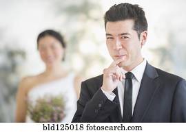 Groom smiling in wedding ceremony