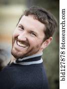 Caucasian man laughing outdoors Caucasian man laughing outdoors