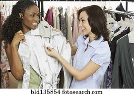 Caucasian dressmaker working with client