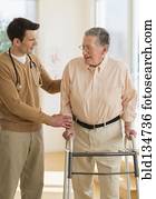 Senior Caucasian man working with physical therapist