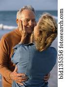 Senior couple hugging on beach Senior couple hugging on beach