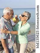 Senior couple hugging on beach