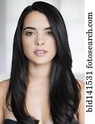 Hispanic woman with long hair smiling