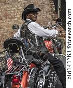 Senior African American man riding motorcycle