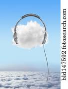 Large headphones on cloud in sky