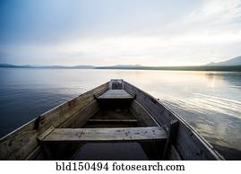 Dilapidated boat on remote lake