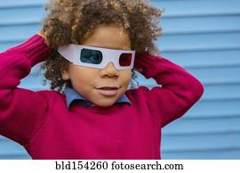 Pacific Islander boy wearing 3D glasses