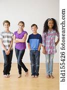Barefoot children smiling in studio