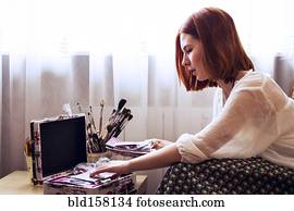 Caucasian woman looking through memory box