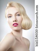 Caucasian woman with glamorous hairstyle and makeup