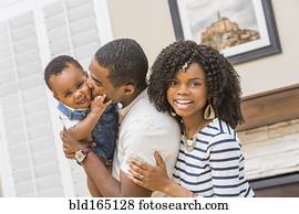 Black family playing in living room