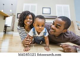 Black family playing on living room floor