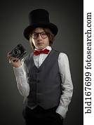 Boy in top hat photographing with vintage camera