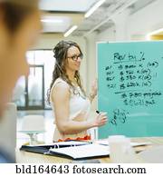 Caucasian businesswomen talking in office meeting