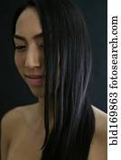 Smiling mixed race woman with long hair