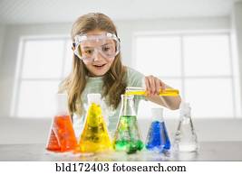 Caucasian girl doing science experiment 