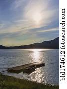 Canoe and wooden dock in remote lake