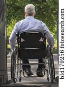 Caucasian businessman in wheelchair exiting van