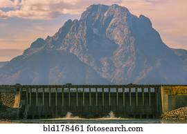 Mountain and dam in remote landscape