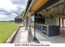 Open-air kitchen and backyard in modern home