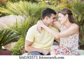 Smiling couple hugging outdoors Smiling couple hugging outdoors