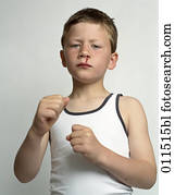 boy raising his fists, bleeding from the nose boy raising his fists, bleeding from the nose