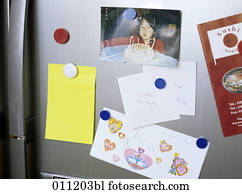 different notes pinned on door of refrigerator different notes pinned on door of refrigerator