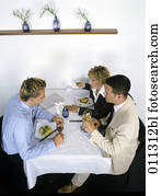 group at business lunch having a controversial conversation group at business lunch having a controversial conversation