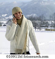 portrait of young man in winter clothes with cellular phone portrait of young man in winter clothes with cellular phone