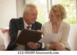 Financial advisor explaining paperwork to woman