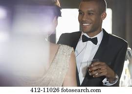 Close up of well dressed couple talking