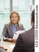 Businesswoman smiling in meeting