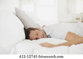 Man sleeping on bed