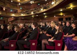 Audience watching performance in theater