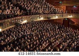 Audience watching performance in theater