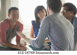 Happy creative business people in meeting