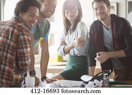 Portrait of creative business people in meeting at desk