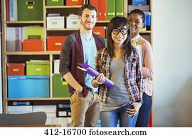 Portrait of smiling creative business people in office