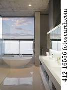 Soaking tub in modern bathroom
