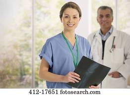 Portrait of smiling nurse with x-ray