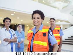 Doctor, nurse and paramedics standing in hospital